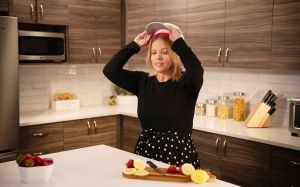 female in using laserhat in kitchen