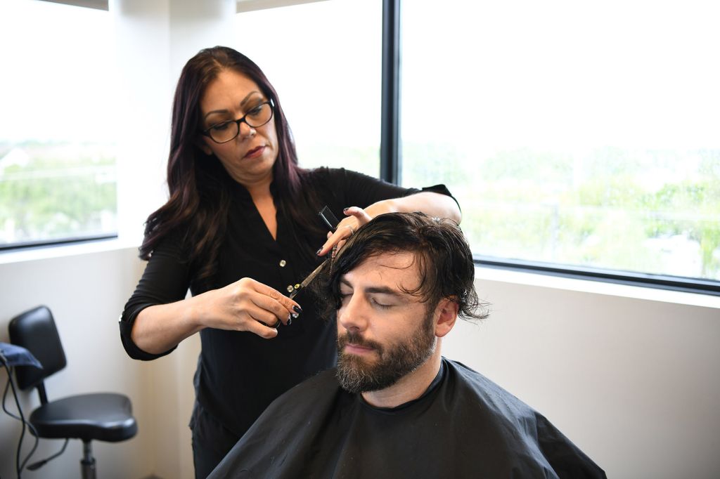 man getting haircut by stylist
